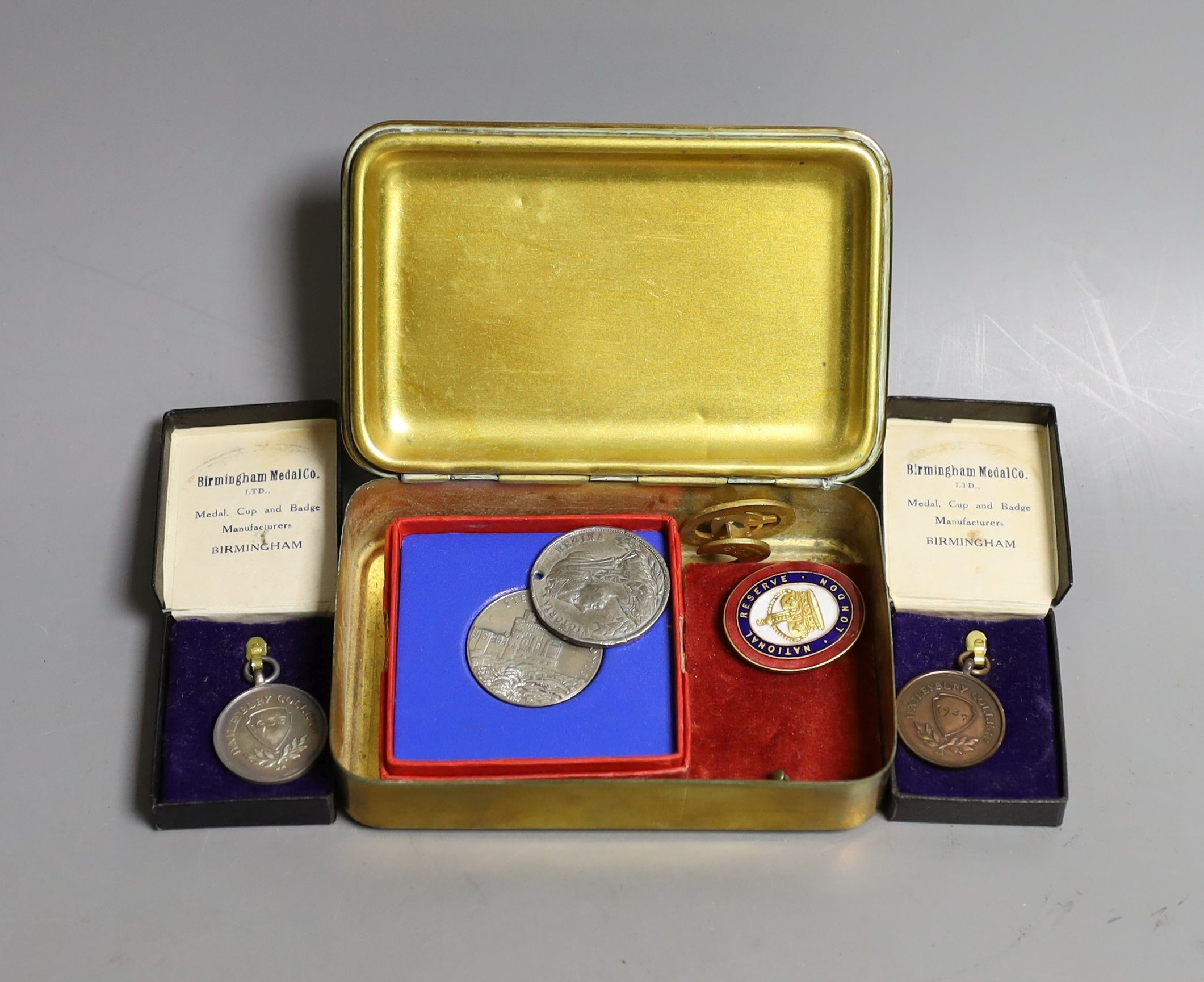 A WWI Queen Mary Christmas box, two National reserve London enamelled badges and two college medals to G. Lovegrove